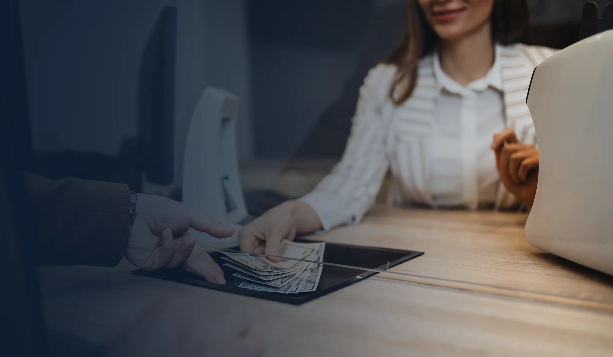 Bank teller serving a customer.