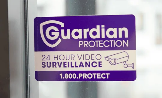 Guardian Protection sticker showing 24-surveillance 