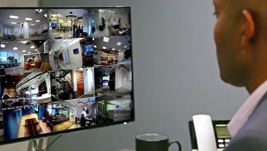 Feeds from Guardian Protection business security cameras on a desktop