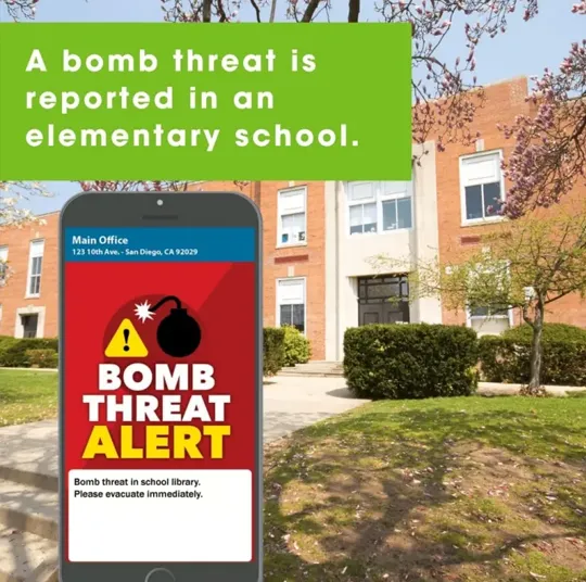 A cell phone receiving a mass notification about a bomb threat alert at an elementary school.