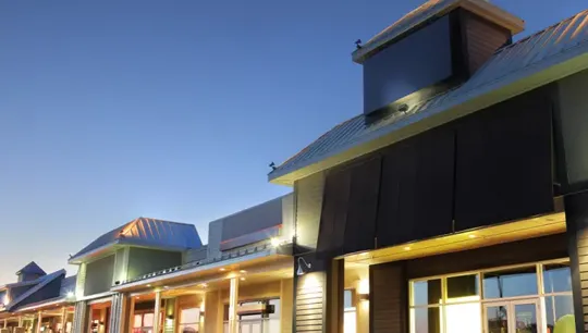 Row of retail shops at dusk