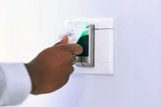 Person using access control to swipe a key card