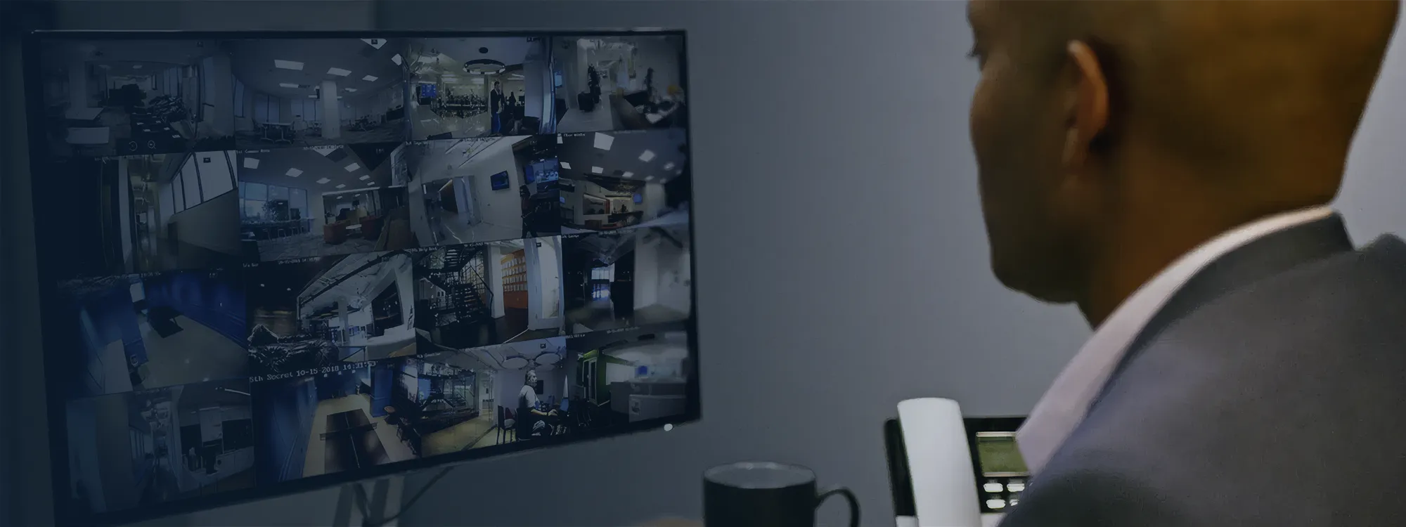 Feeds from Guardian Protection business security cameras on a desktop.