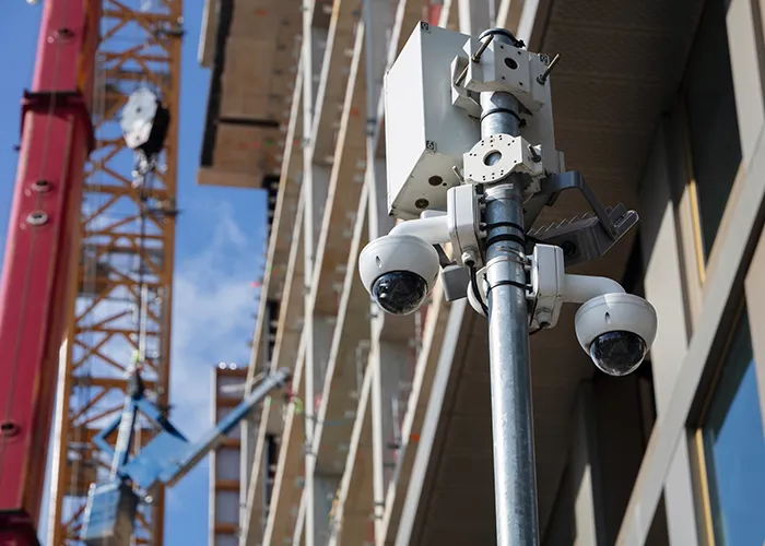 Construction workers on a job site with heavy machinery.