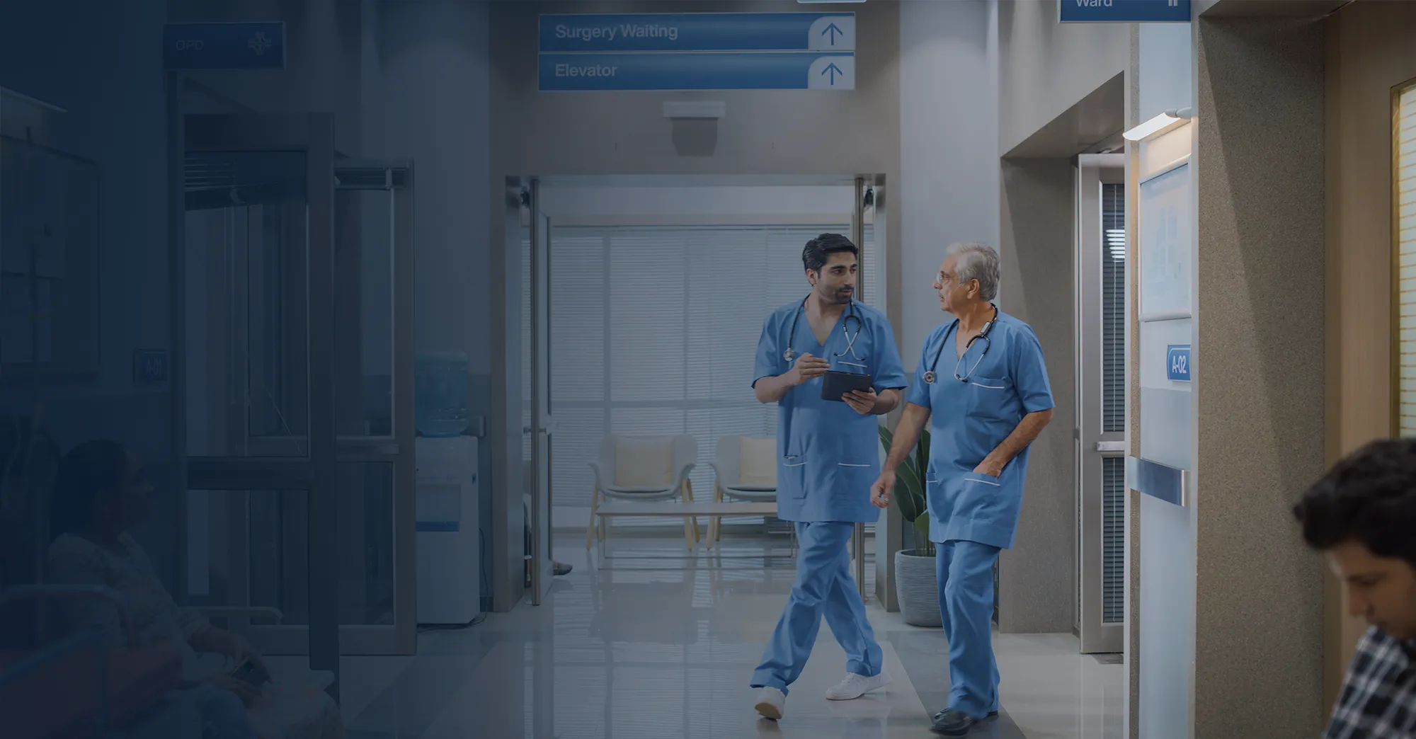 Healthcare professionals in a hospital corridor.