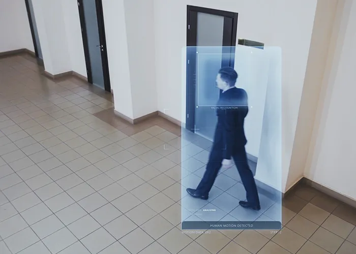 Security camera overlooking a hotel lobby and parking area.