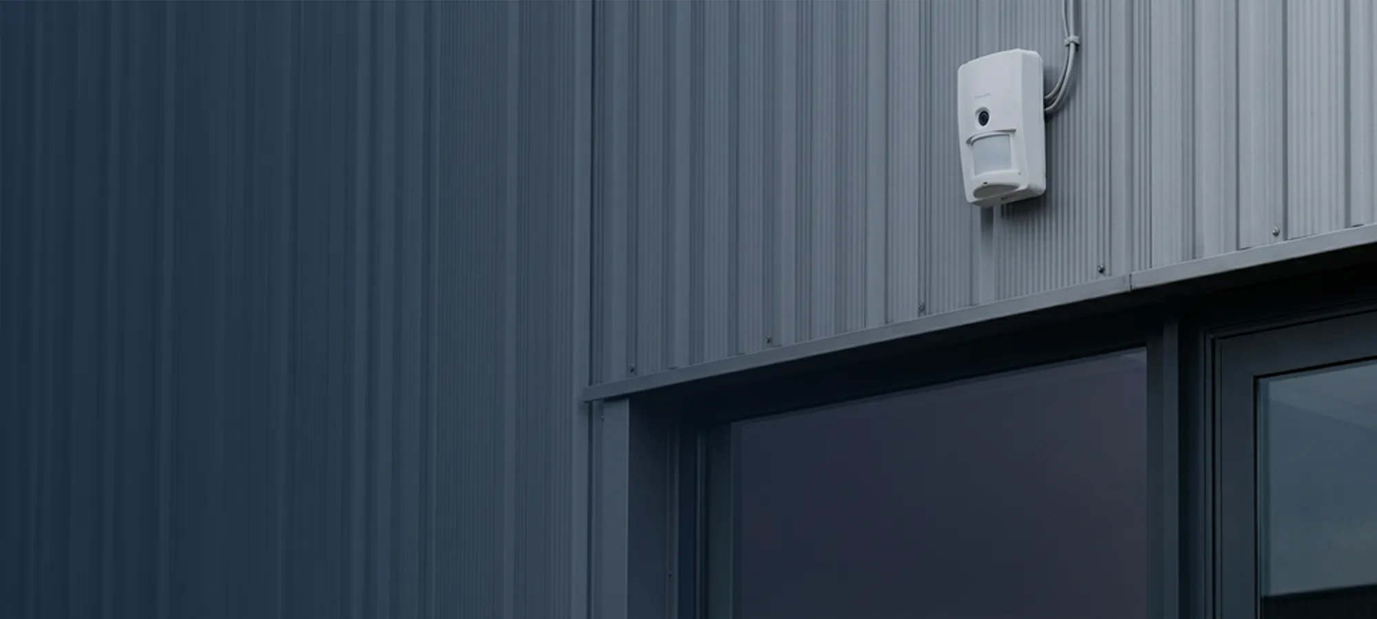 Guardian Protection exterior motion detector on a commercial building.