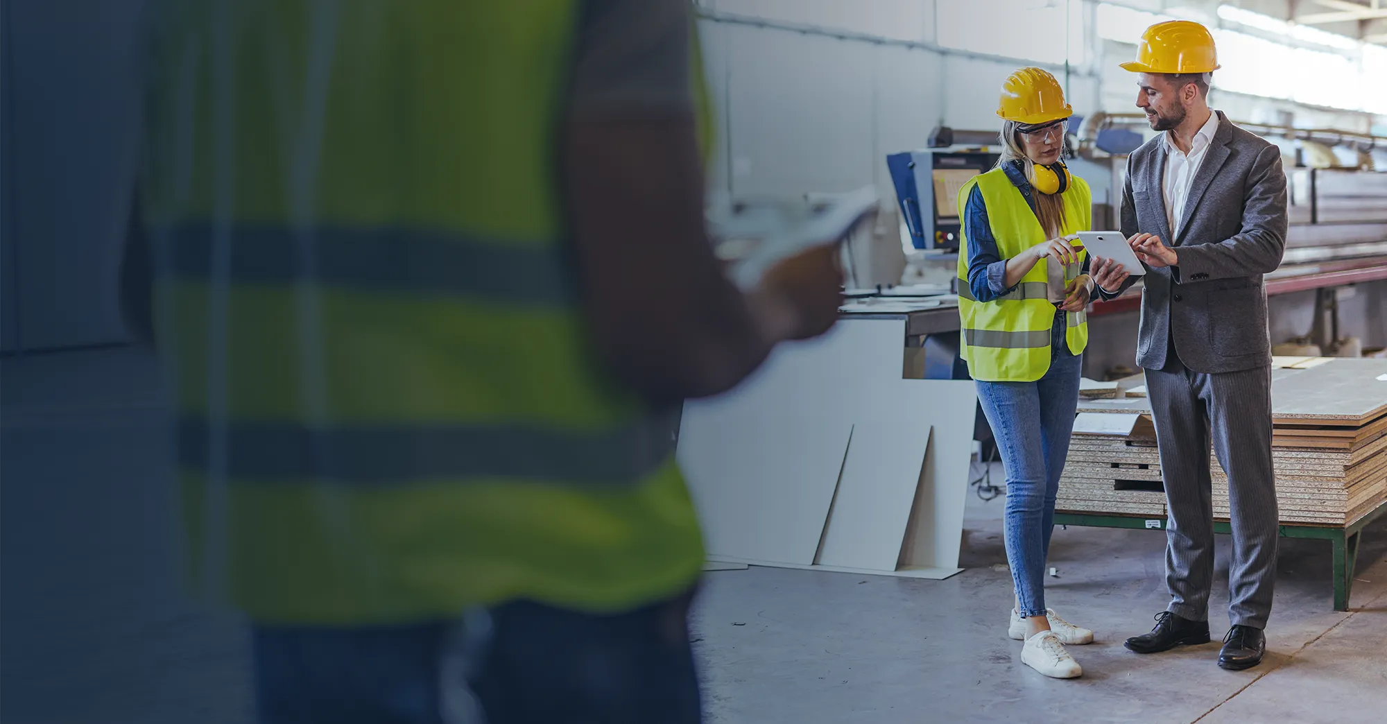 Workers on a manufacturing plant floor.