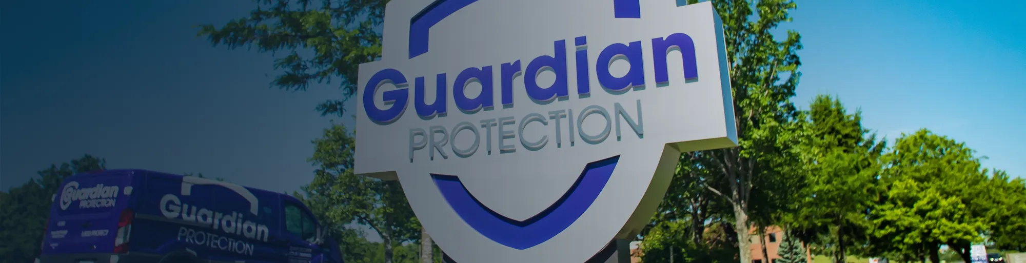 Guardian Protection sign and van in front of Guardian's headquarters.