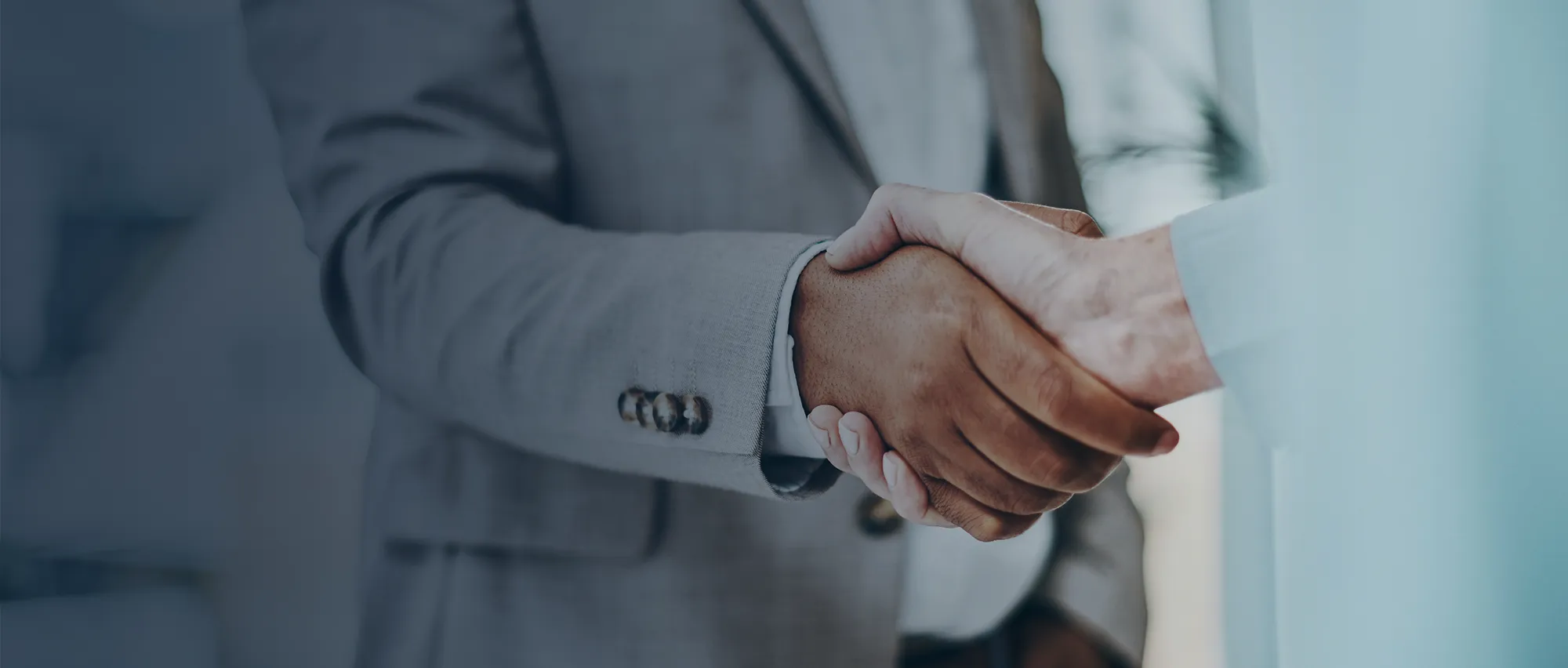 Business partners shaking hands.