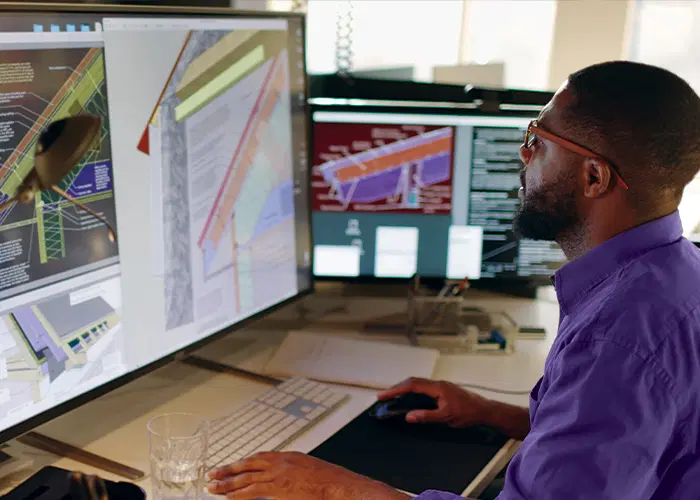 Guardian Protection security professional working to design business security system for client.