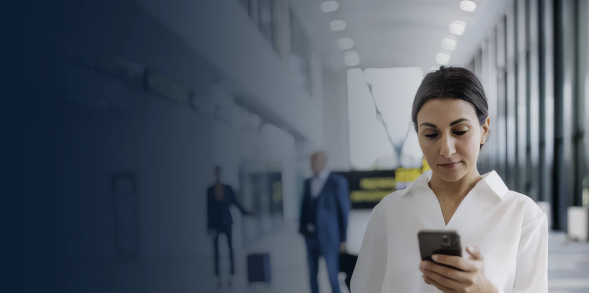 Business owner managing multi-location security from a laptop dashboard.