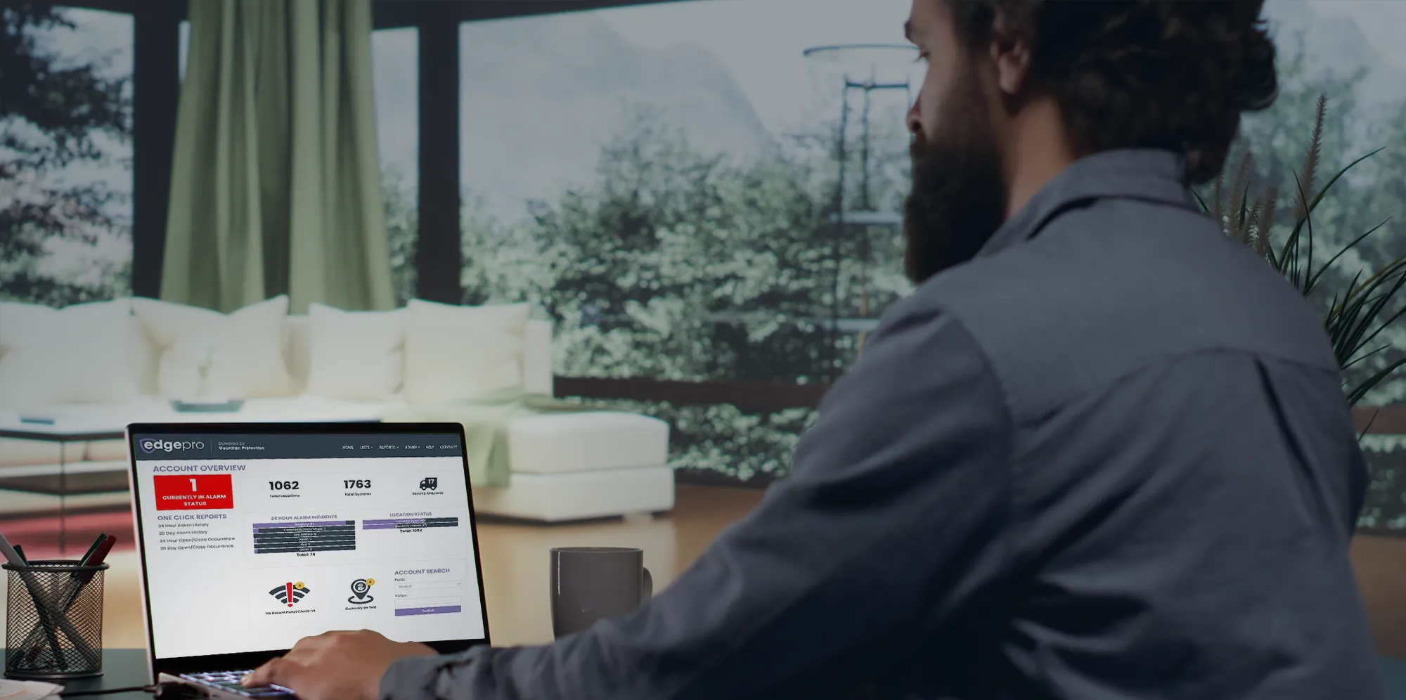 Business security professional reviewing multi-site dashboard remotely.