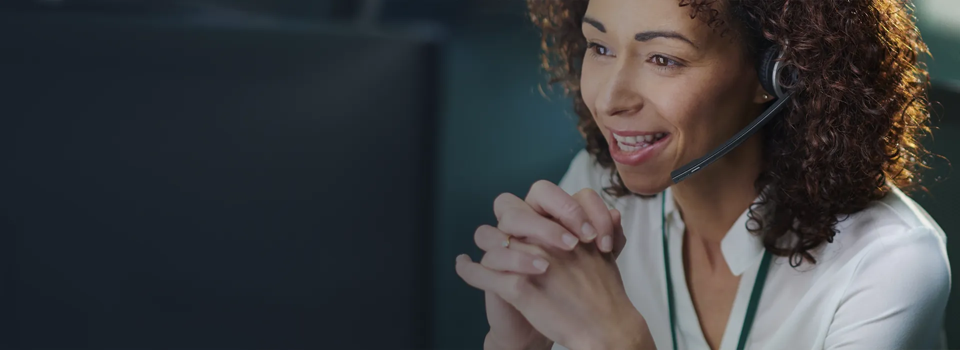 Guardain sales representative speaking to a client on a headset.