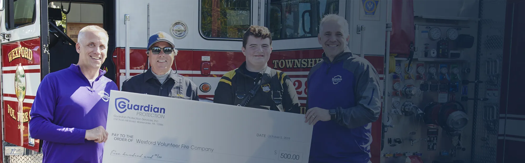 Guardian leadership presenting a check to a local Volunteer Fire Department.