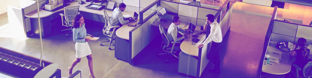 Men and women working at desks in an office