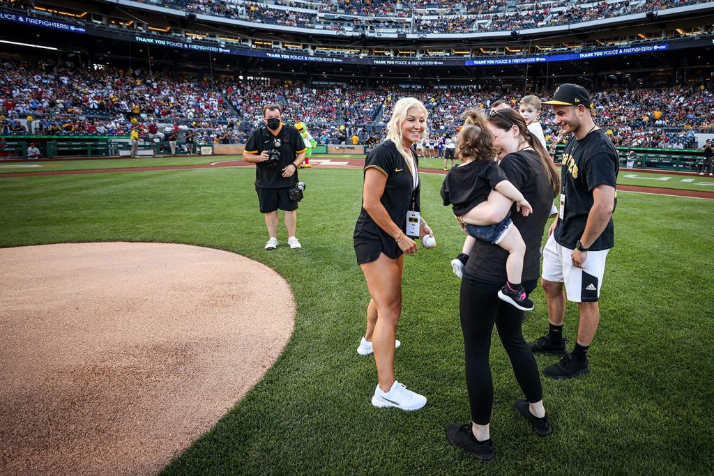 Police Officer, Kristin Mitrisin, reunites with baby Olivia on field during first pitch.