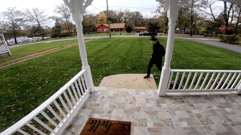 View from Video Doorbell Camera of man approaching a home's front porch