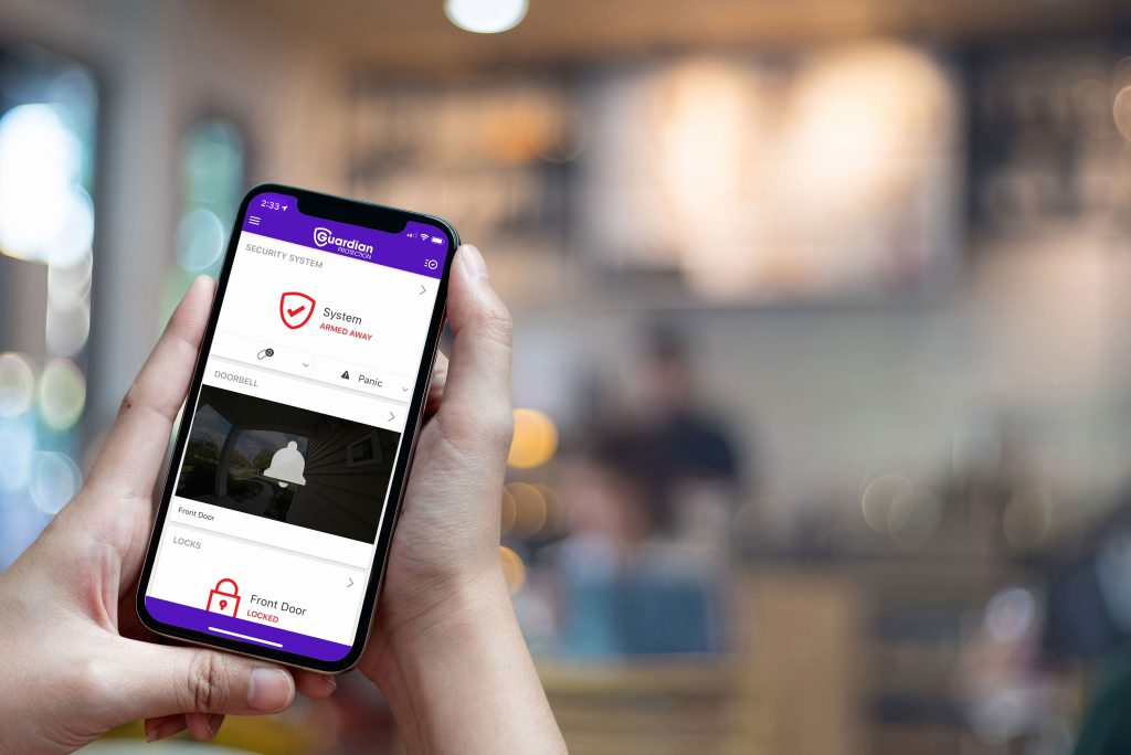 Person checking the Guardian Protection mobile app