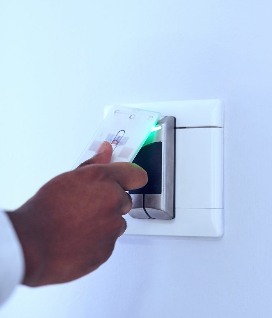 Person using access control to swipe a key card