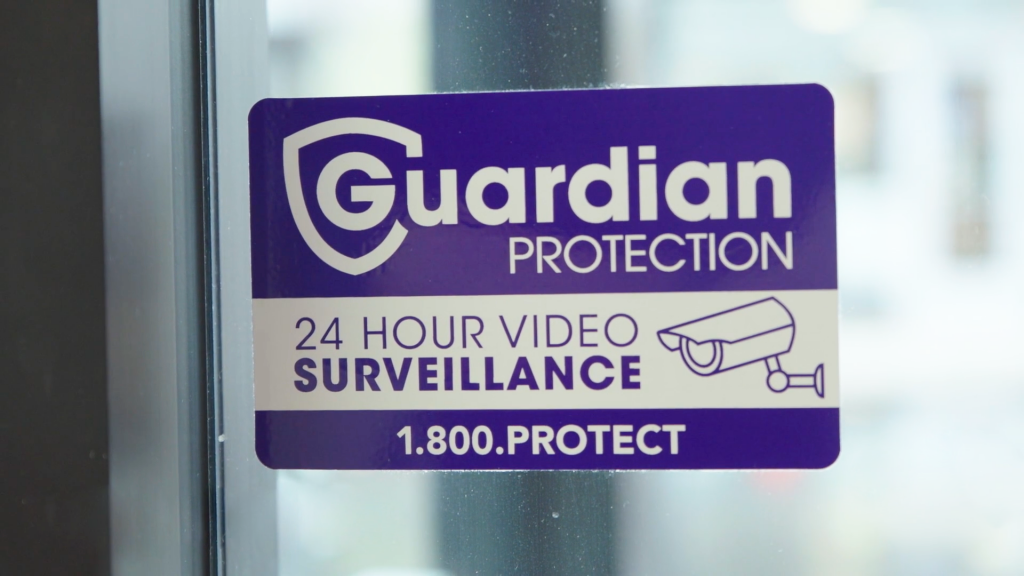 Guardian Protection 24-hour Video Surveillance sticker on window