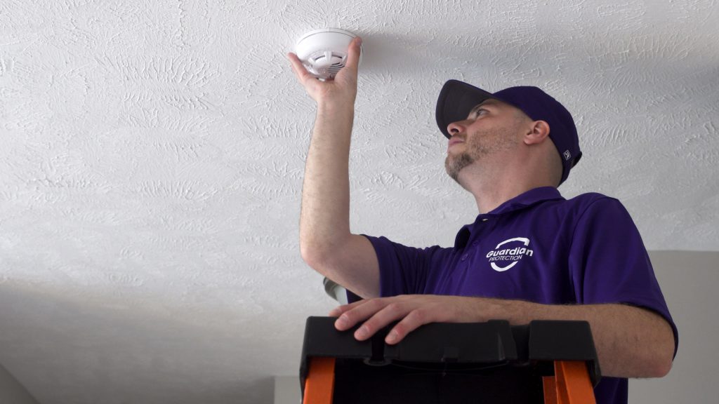 Installer for Guardian Protection installing a smoke & heat protector