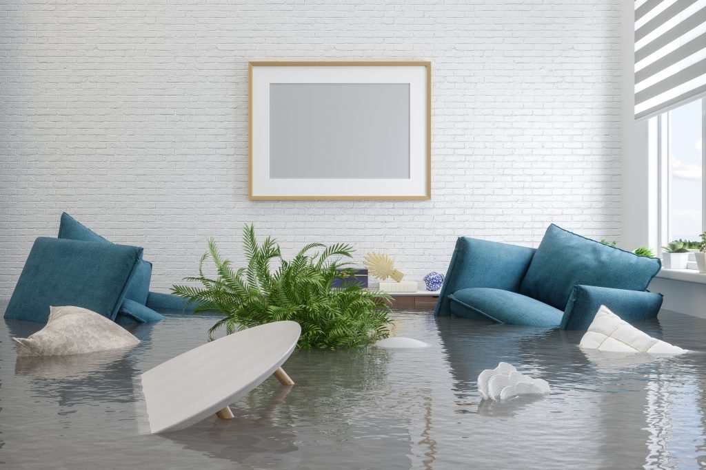 Living room furniture half submerged in a house flood