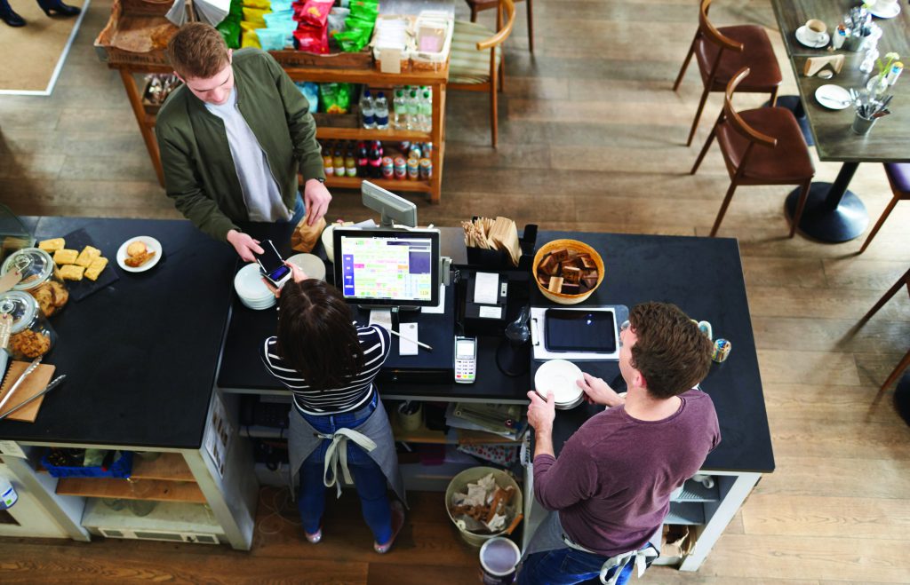 Overhead view of customer at restaurant check out