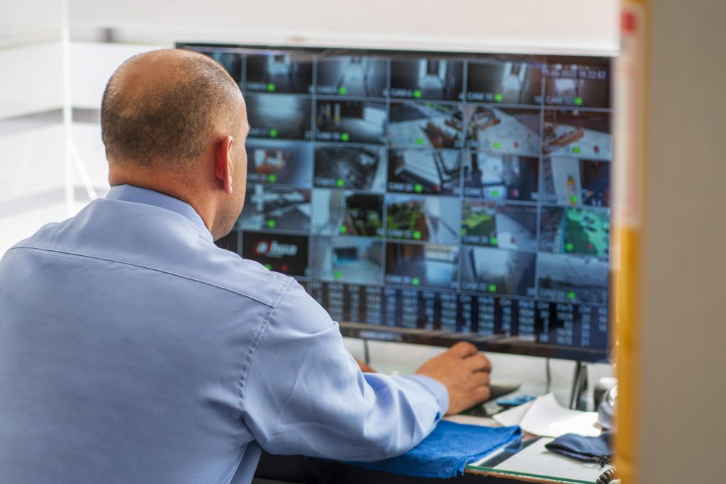 Man looking at his Guardian Protection business security camera live feeds