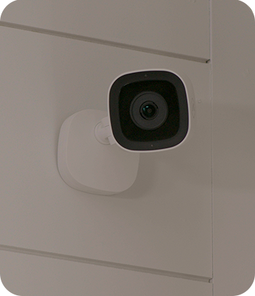 Indoor home security camera installed on home's wall