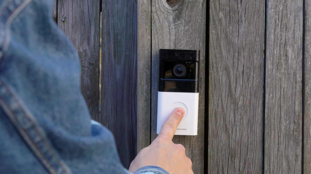 Person ringing a wireless Guardian Protection video doorbell