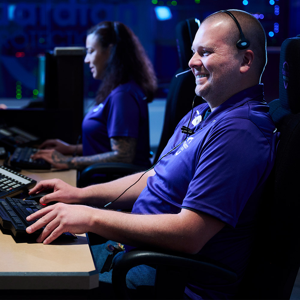 Two Guardian Protection Specialists working in the Monitoring Center