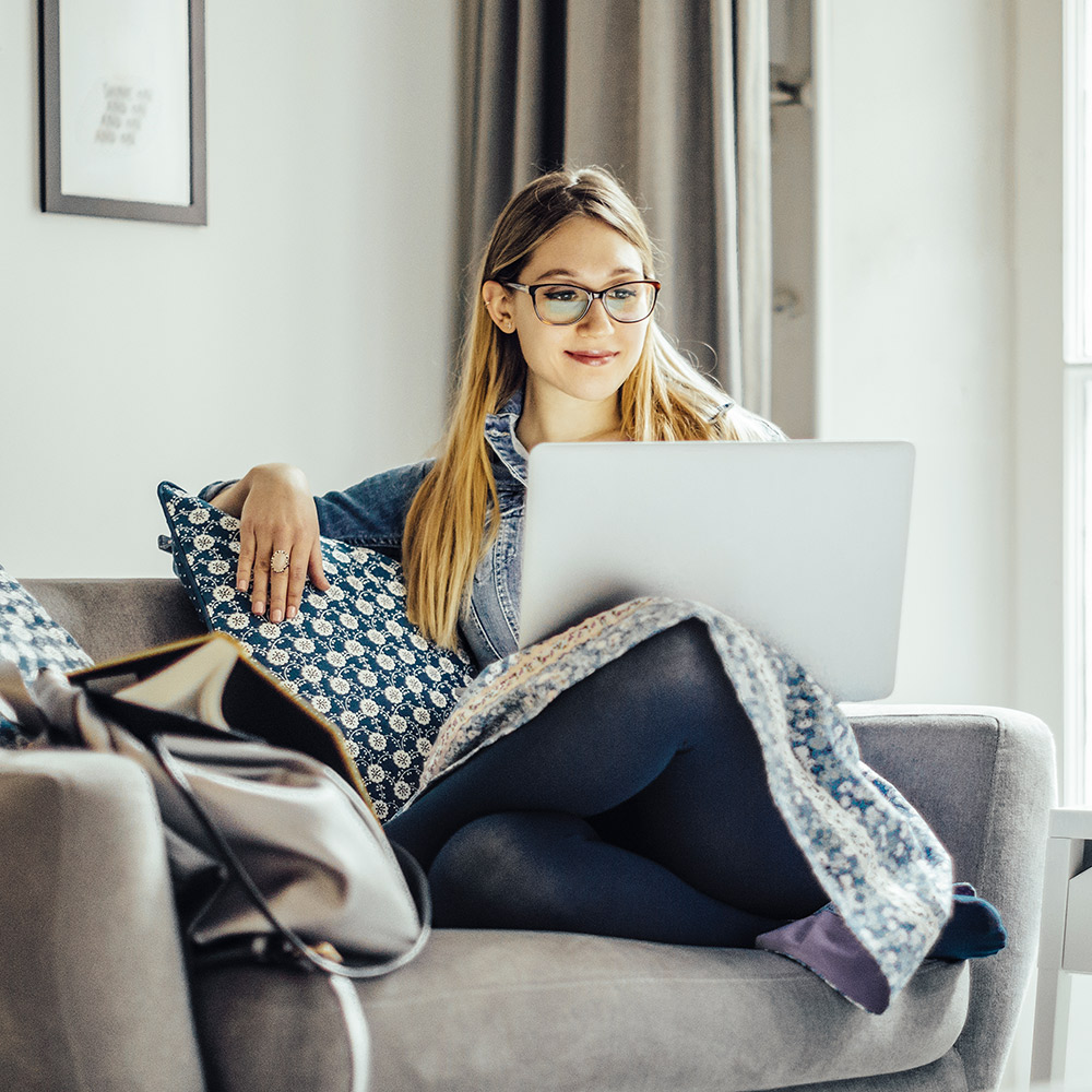 Woman on her laptop on Guardian Protection's website