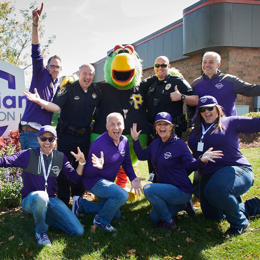 Guardian Protection Pittsburgh team members and Pittsburgh Pirate Parrot