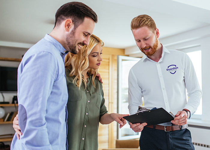 Guardian Protection security consultant discussing options with couple in their home