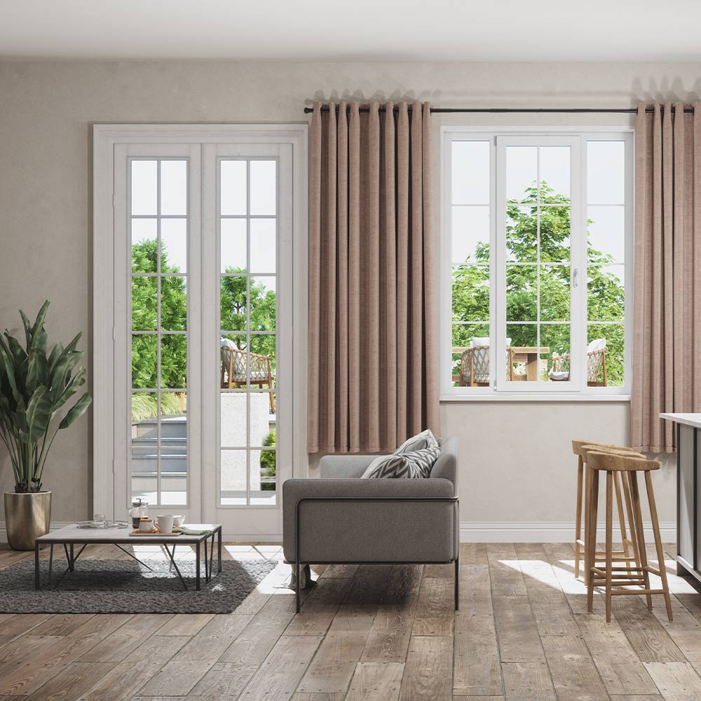 Living room with window and glass door looking out to backyard