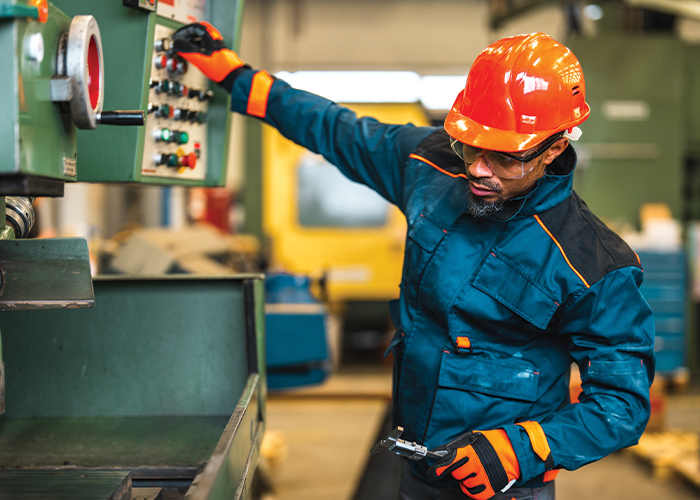 Manufacturing worker practicing safety on the job