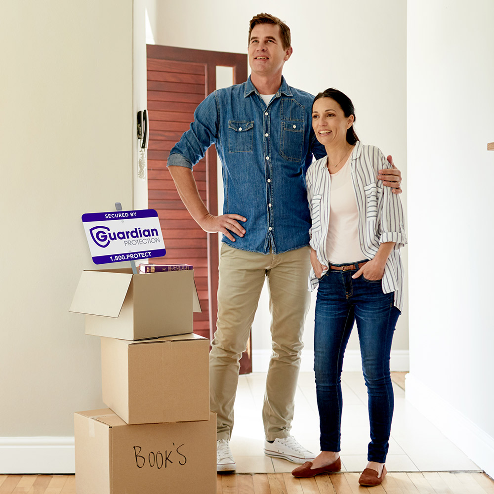 Family moving into a new home that will be protected by Guardian Protection's smart home security devices