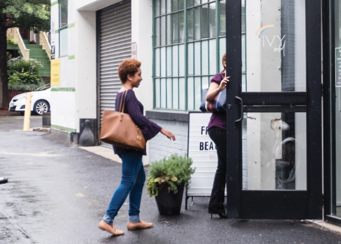 Employees entering a building that's protected by Guardian Protection's smart business security system