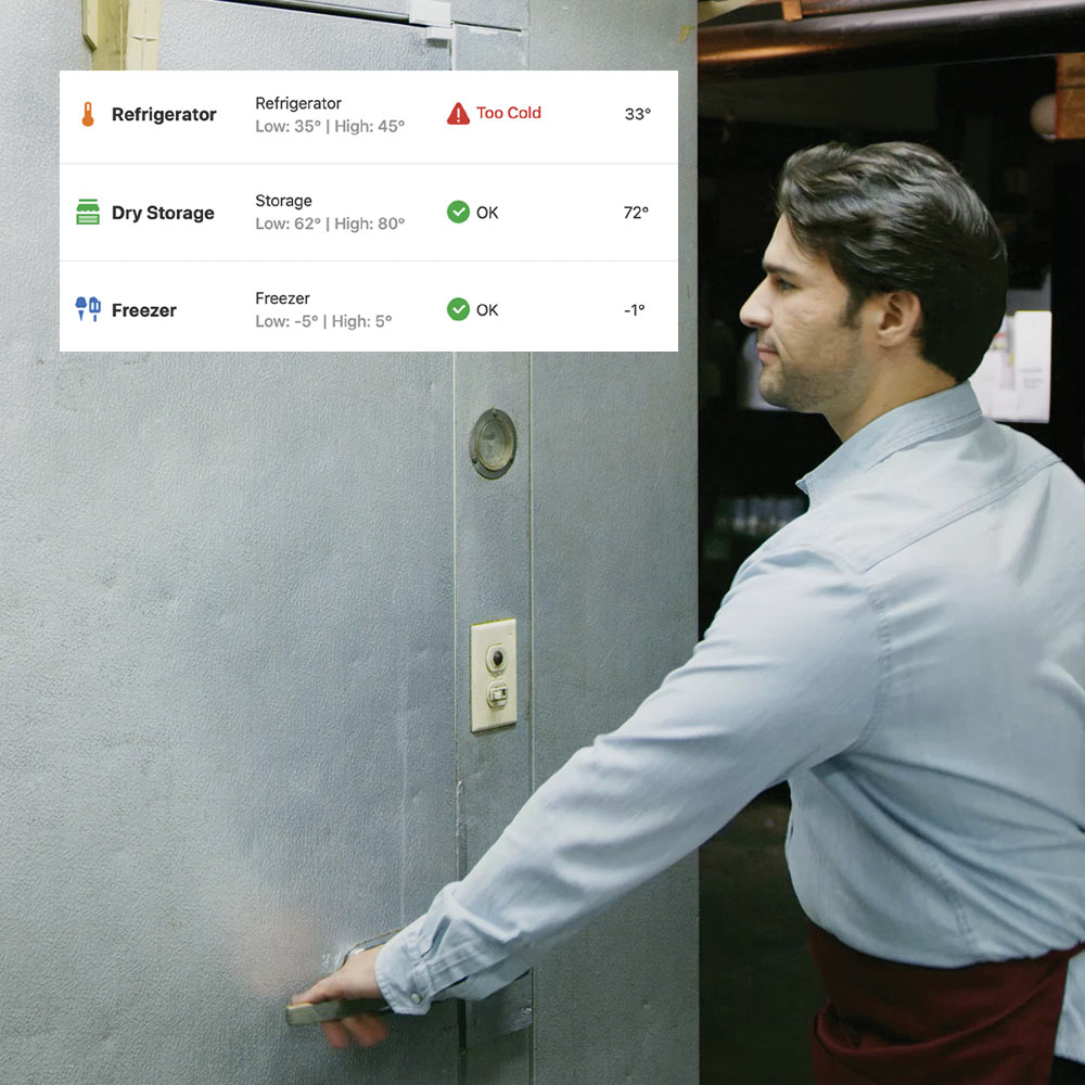 Restaurant employee about to enter a refrigerator with the temperature data displayed