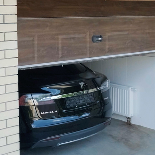 Guardian Protection smart garage door opener mounted on a garage door