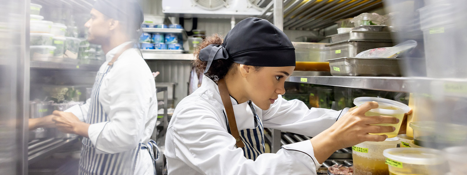 Employees at a restaurant working in the kitchen