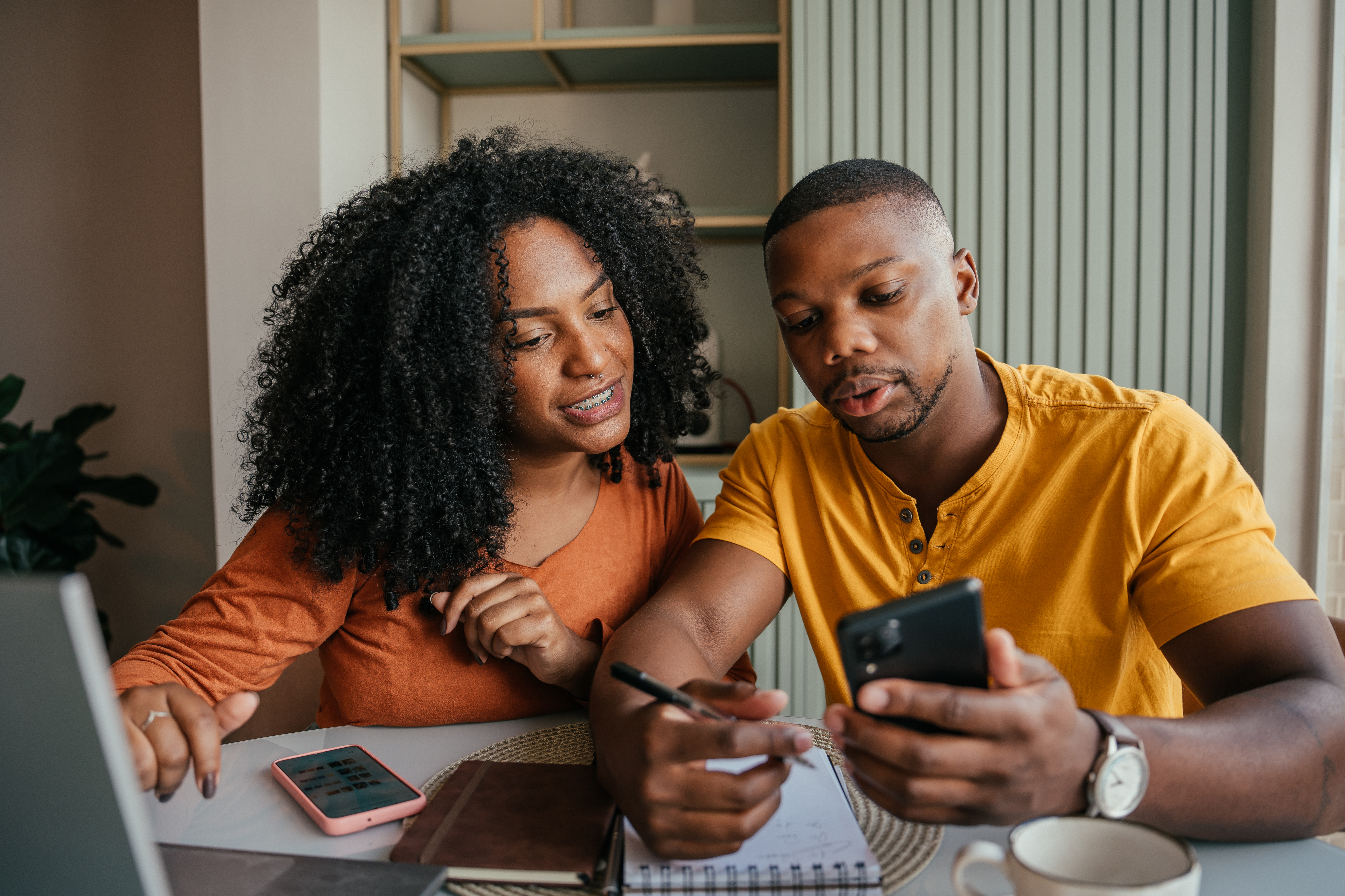 Couple financially planning and looking into home security
